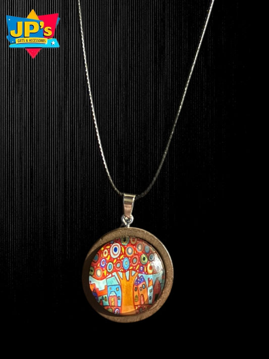Wooden cabochon tree pendant necklace with colorful illustrated design under glass dome on silver chain.