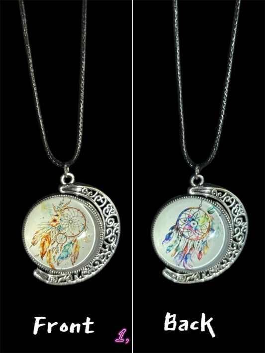 Double-sided spinning dreamcatcher pendant with silver ornate frame on chain, showing golden and multicolor designs.
