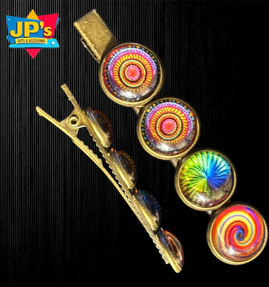 Set of boho-inspired small hair clips with gold metal bases and colorful mandala resin domes in various patterns.