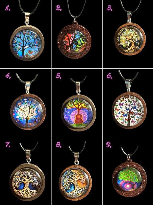 Nine wooden cabochon tree pendant necklaces with multi-colored designs in glass domes, featuring various tree of life artistic styles.