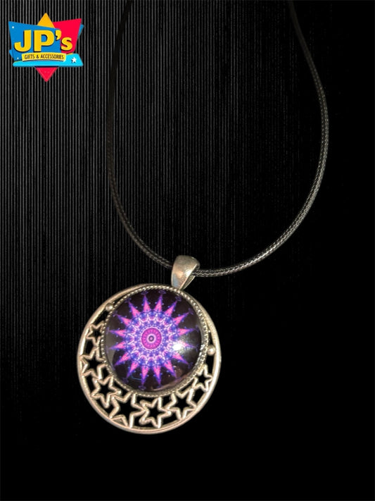 Small patterned cabochon necklace with purple mandala design in silver filigree moon-shaped pendant on black cord.