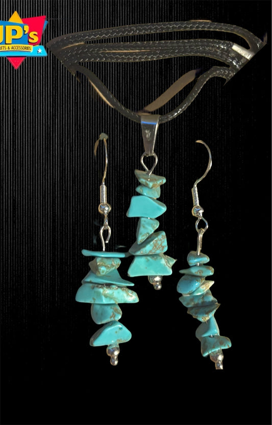 Turquoise gemstone chip earring and necklace set with silver components on black background.